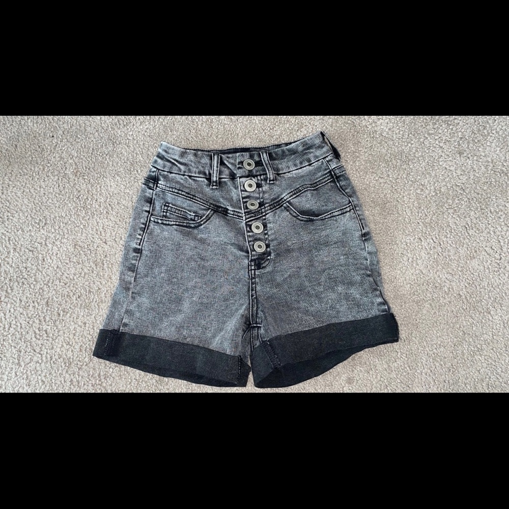 Black distressed curvy super high-rise shorts.